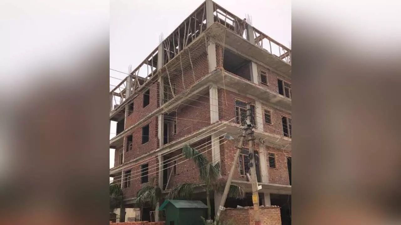 Construction of five storey apartment illegally by breaking rules