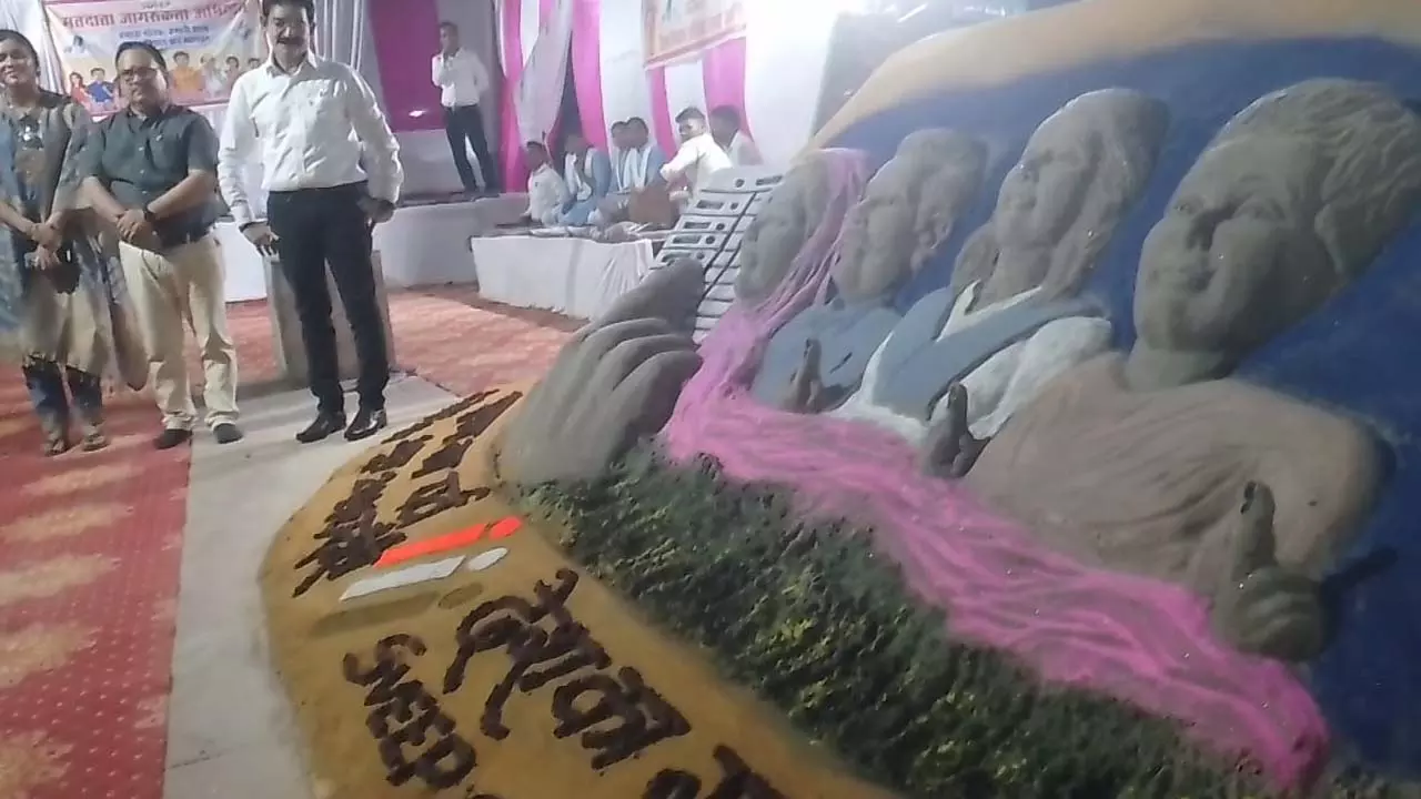 Sand artists created awareness about voting with the figure of a voter and the symbol of EVM