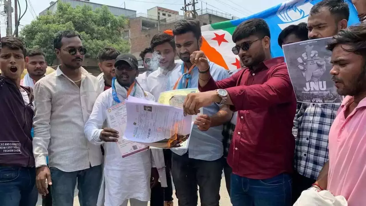 NSUI protests against irregularities in NEET exam by burning results