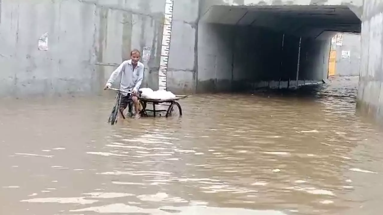 Rain divided the city into two parts, railway underpass submerged, pedestrians troubled