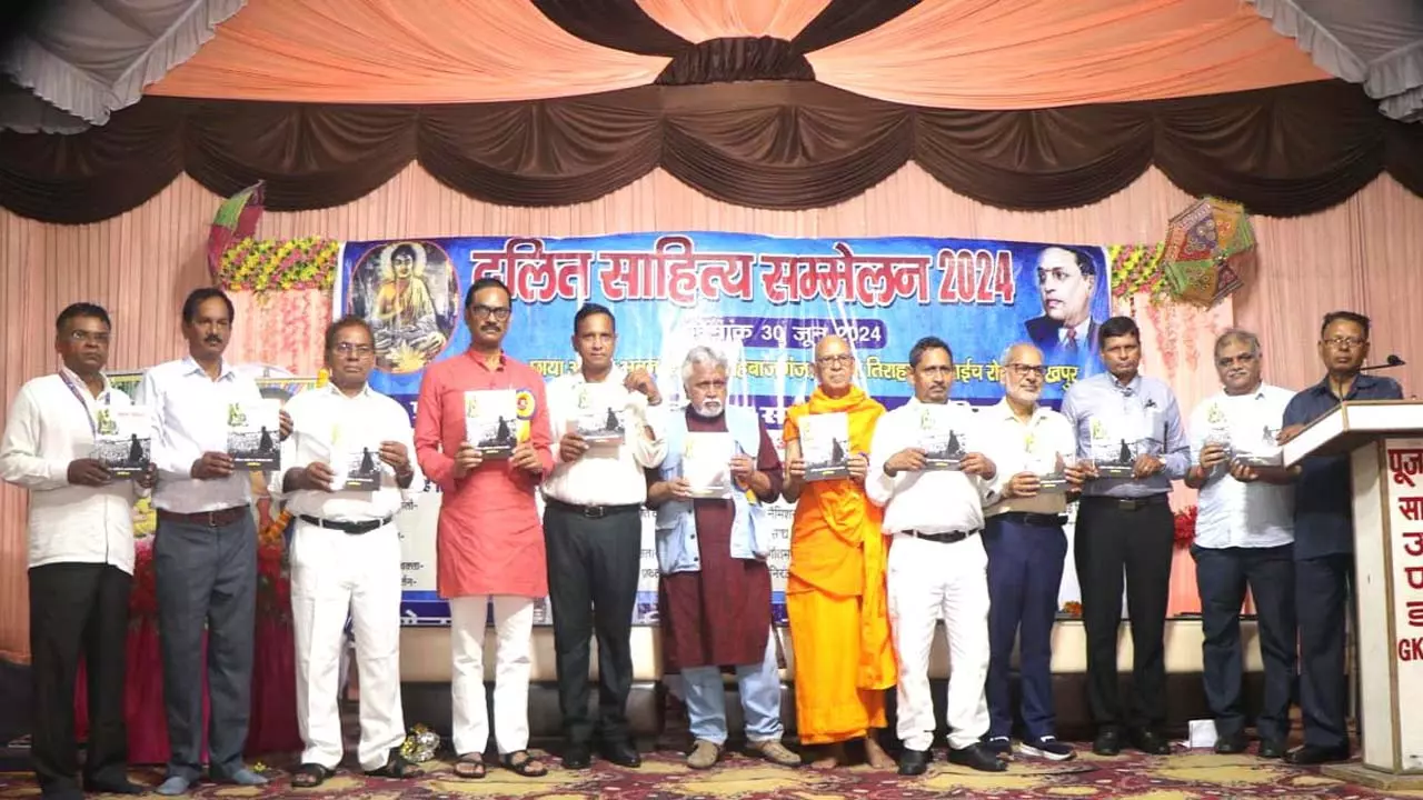 Speaker speaking at Dalit Literature Conference, Souvenir released