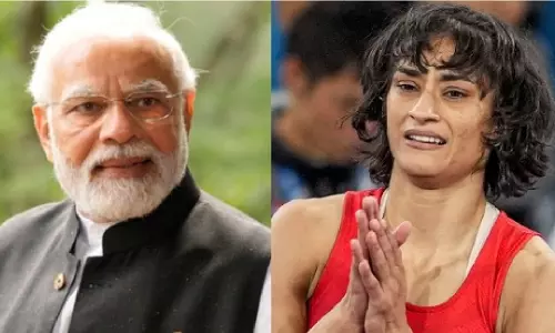 PM Modi and Vinesh Phogat