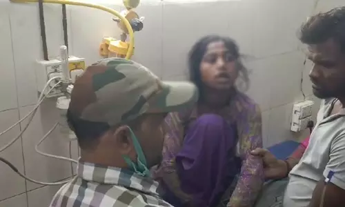 Young woman seriously injured by falling soil dust while digging
