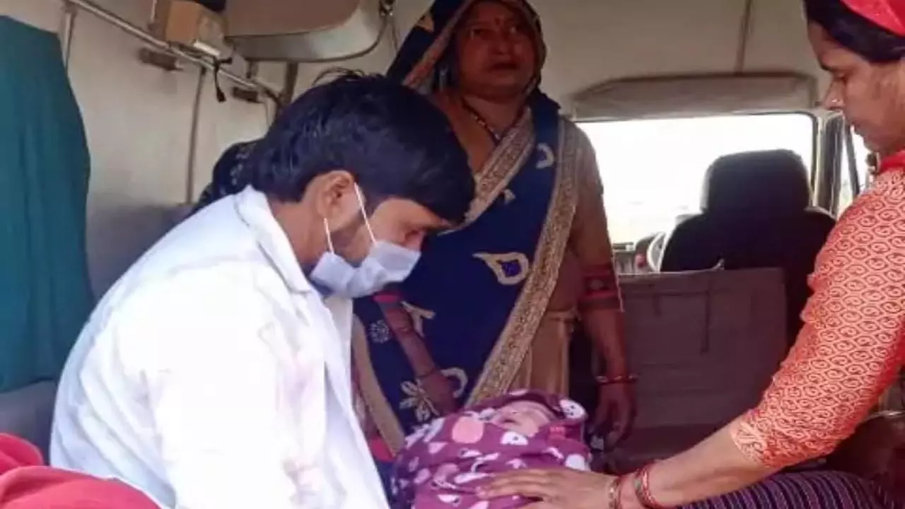 Woman gives birth to baby during labor pain in trapped ambulance in traffic jam