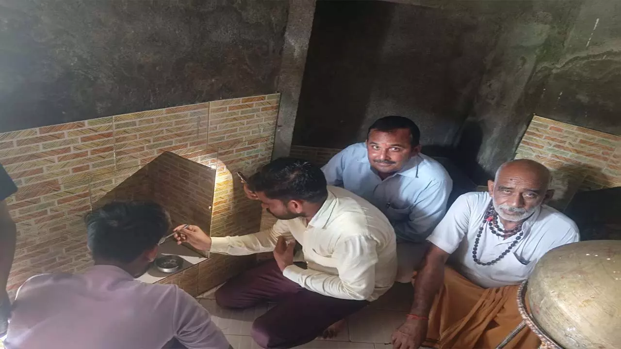 Nandi drinking milk and water in ancient Shiva temple, wave of faith in villagers