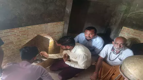 Nandi drinking milk and water in ancient Shiva temple, wave of faith in villagers Nandi drinking milk and water in ancient Shiva temple, wave of faith in villagers
