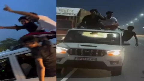 Hapur News: NH-9 पर युवकों की स्टंटबाजी, स्कॉर्पियो की छत पर बैठकर मचाया हुड़दंग, पुलिस ने काटा चालान Hapur News: NH-9 पर युवकों की स्टंटबाजी, स्कॉर्पियो की छत पर बैठकर मचाया हुड़दंग, पुलिस ने काटा चालान