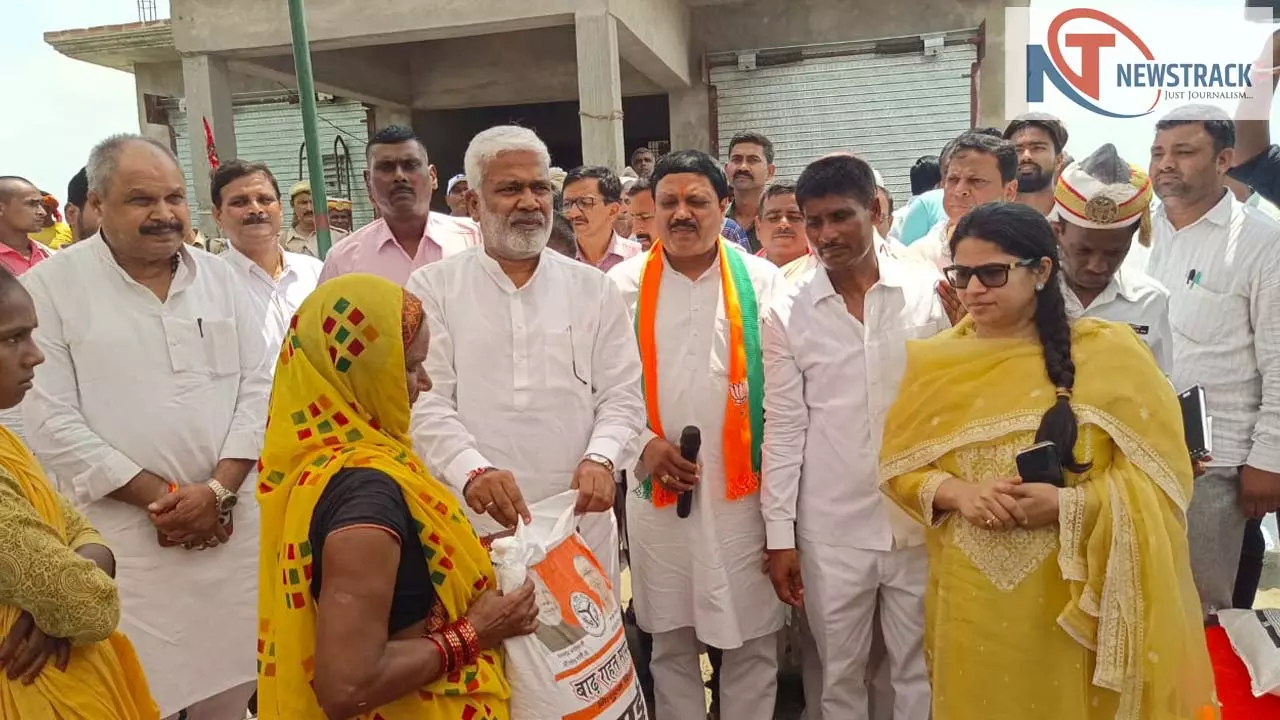 Jal Shakti Minister Swatantra Dev Singh distributes relief materials in flood affected areas