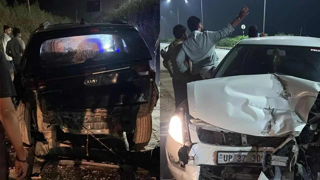 Hapur News: हाईवे पर रफ्तार का कहर: धनौरा कट के पास दो कारें भिड़ीं, पांच घायल, एक कार खाई में गिरी