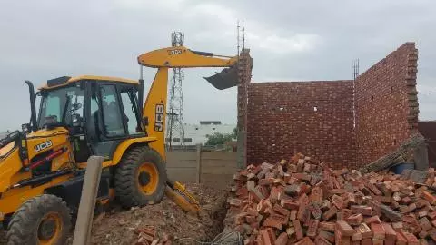 bulldozer action illegal construction demolished