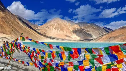 Ladakh Tourism 2026 tourist rush breaks record at Pangong Lake and Nubra Valley Summer travel