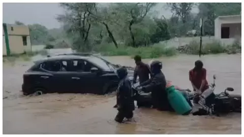 Flood in pahada River villagers crossing rivers with buggies at risk Flood in pahada River villagers crossing rivers with buggies at risk