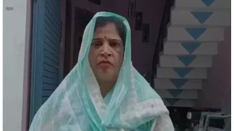 Snatching earrings from woman returning from Shivalaya sprinkling water