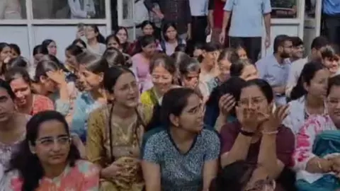 MBBS students stage sit-in at medical college over induction stove seizure MBBS students stage sit-in at medical college over induction stove seizure