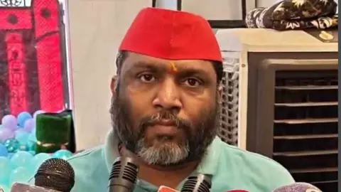 Politics, SP leaders tear up posters over controversial hoardings Politics, SP leaders tear up posters over controversial hoardings